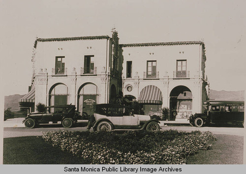 Pacific Palisades Business Block with automobiles and the Village Green in the foreground