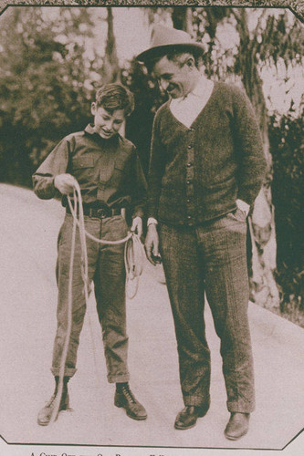 Will Rogers teaches son, Will Rogers Jr. how to rope at their Beverly Hills Ranch in California, appearing in an article for "Pictorial California Magazine."