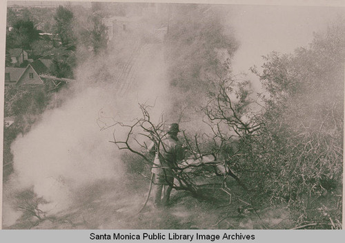 Fire fighter in Upper Temescal Canyon, Calif