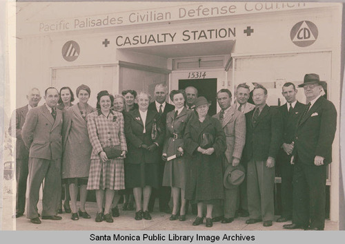 Volunteers stand in front of the Pacific Palisades Civil Defense Council Casualty Station