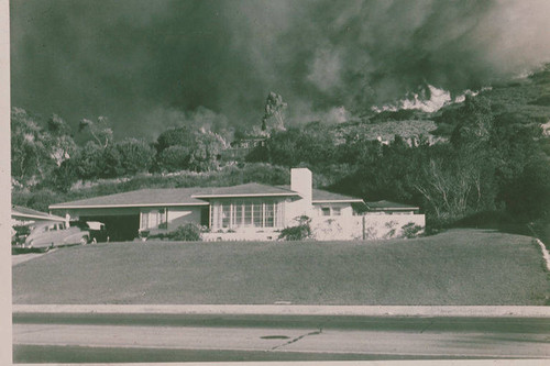 Fire burning near homes in Pacific Palisades, Calif