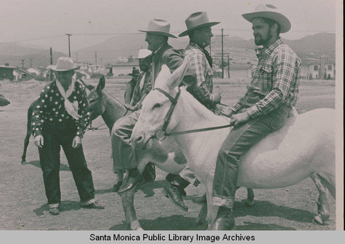 Cowboys on their horses at the Fiesta Day Parade in Pacifc Palisades, Calif