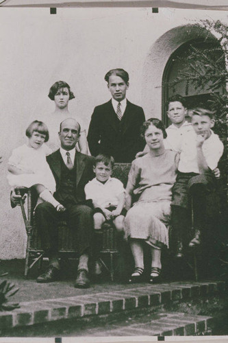 Charles Scott and family on the porch of their home in Pacific Pailsades, Calif