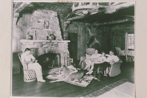 Will Rogers family (left to right: Will Jr., Jim with pet calf Sara, Betty, Mary with dog Jacque, Will Sr.) in the weekend cabin at the ranch house in Rustic Canyon, Calif