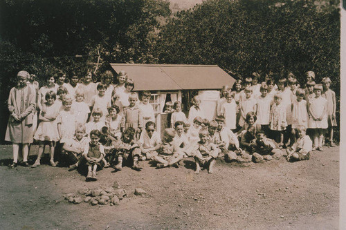 Portrait of a group of women and children in Temescal Canyon, Calif