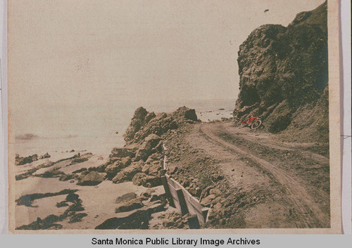 Site just after the dynamiting of Arch Rock with a bicycle in the background