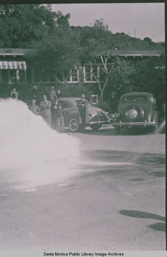 Firemen demonstrating how to extinguish phosphorus bombs in the event of an attack at Assembly Camp, Temescal Canyon, Calif