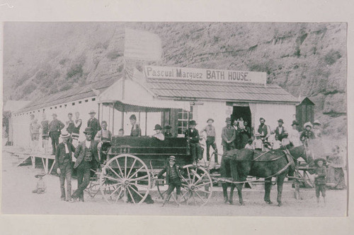 People with their wagons in front of the Pascual Marquez Bath House in Santa Monica Canyon