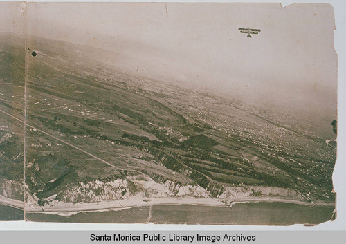 Airplane flies over Pacific Palisades and the coastline of Santa Monica Bay