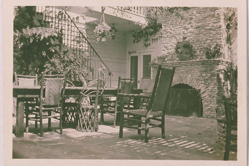 Dining area with fireplace on the back patio of the main house of Will Rogers Ranch, Rustic Canyon, Calif