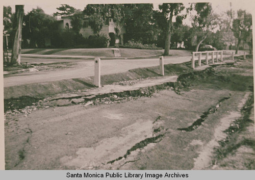 Barrier along the edge of Via de Las Olas after the killer landslide of 1958