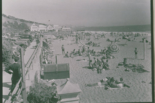 People sunbathing on the beach near Santa Monica Canyon, Calif