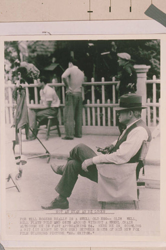 Will Rogers relaxing on the set of one of his movies