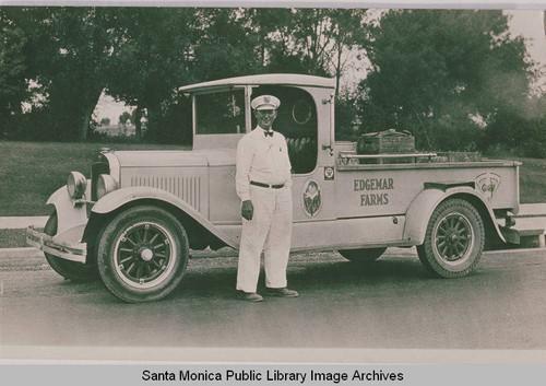 Milkman H. B. Taylor in front of an Edgemar Farms delivery truck in Pacific Palisades, Calif