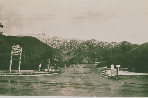 Entrance to Assembly Camp with snow-capped mountains in the background