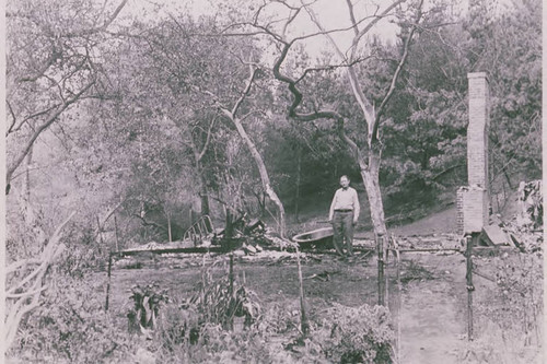 Leo Urban standing in the ruins of his house burned down by a fire