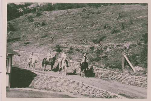 Will Rogers Family (Left to right Will Jr., Betty, Will Sr., and Mary) riding horseback at the ranch in Rustic Canyon, Calif