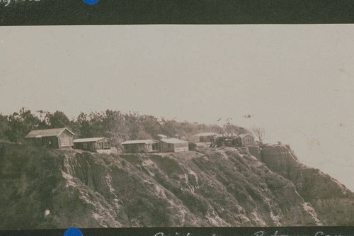 Shacks on top of a bluff in Huntington Palisades, Calif