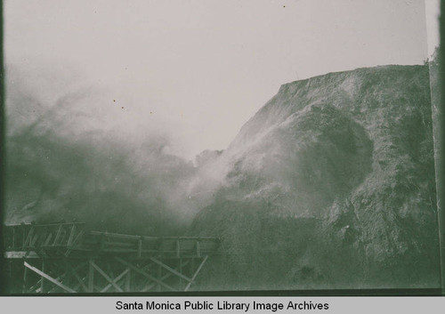 Dynamiting a hill at the Gravel Quarry in Temescal Canyon, Calif