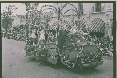 Women riding a float in the Pacific Palisades Fiesta Day Parade