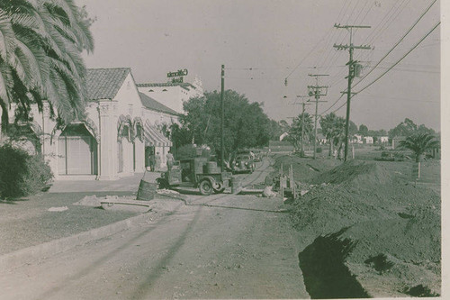 Construction underway on a street next to Pacific Palisades Business Block to widen Antioch Street