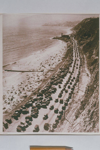 View of the lighthouse and Pacific Coast Highway looking north from the bluffs of Pacific Palisades, appearing in an article for "Pictorial California Magazine."