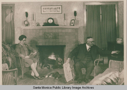 Interior of a house on Swarthmore Avenue showing a Palisades family in front of a Batchelder fireplace