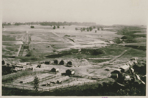 The mule grading camp with large bales of hay at Galloway Street looking toward the Huntington Palisades