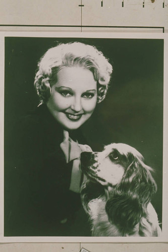 Portrait of actress Thelma Todd with her dog