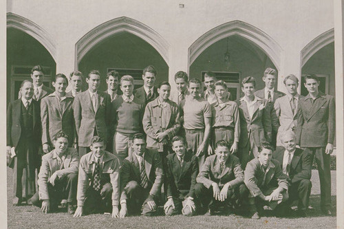 Group portrait of young men in front of a church