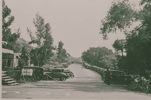 Automobiles parked in Assembly Camp, Temescal Canyon, Calif