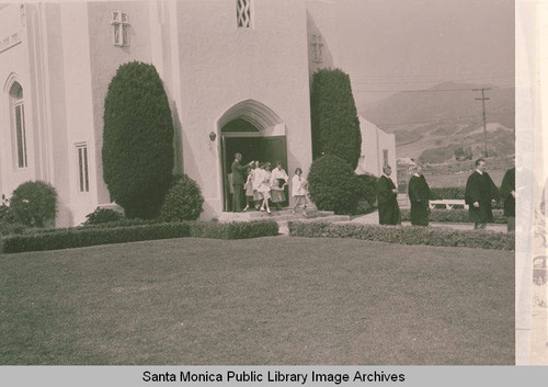 Parishoners and clergy exiting the Methodist Church on Via de la Paz, Pacific Palisades, Calif