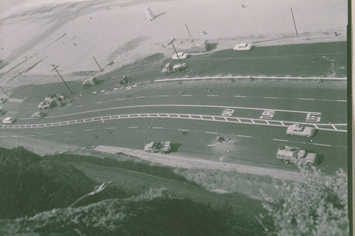 Aerial view of trucks and spilled cargo on Pacific Coast Highway