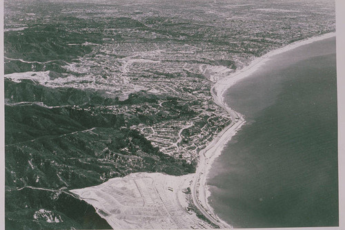 Aerial view of the coast showing grading of the Palisades, Los Liones Canyon and the Getty Museum, April 19, 1962