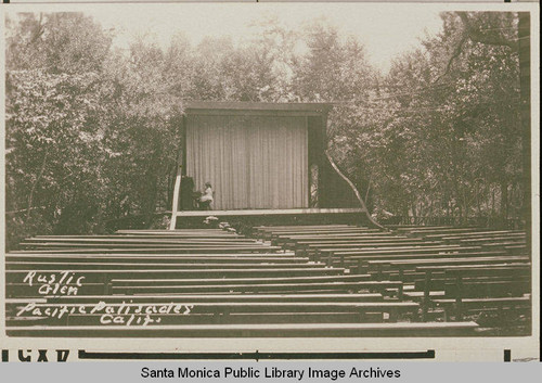 A play or rehearsal in progress at Rustic Glen Amphitheater, Temescal Canyon with oaks and sycamores in the background