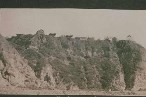 Shacks on top of a bluff in Huntington Palisades, Calif