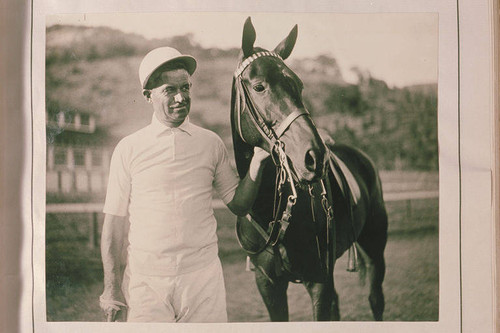 Will Rogers dressed in full polo regalia with his polo horse at Will Roger's Ranch in Rustic Canyon, Calif