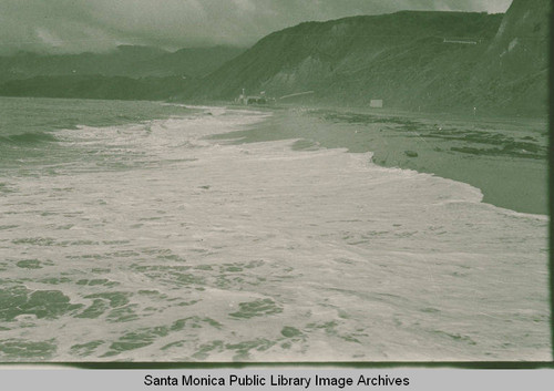 View of the beach after a storm looking at the bluffs of Pacific Palisades