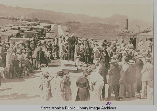 Reverend Charles Scott speaking to a crowd at the ceremonies marking the completion of grading on Beverly (Sunset) Blvd. from Los Angeles to Pacific Palisades, August 18, 1925