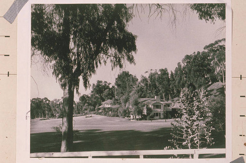 The main house and fenced in grounds at Will Rogers State Park, Rustic Canyon, Calif