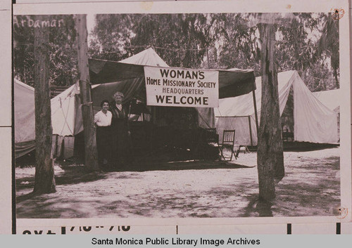 Two women stand outside a tent at Arbamar (dedicated 1905), home of the Methodist annual October Chautauqua, in Huntington Beach, Calif