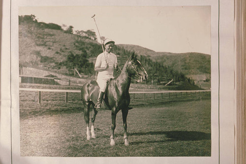 Will Rogers in full polo regalia on his horse at the ranch in 