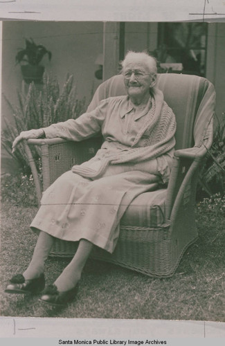 Portrait of Mrs. Mary Jenney born May 10, 1840, sitting in a wicker chair, Pacific Palisades, Calif