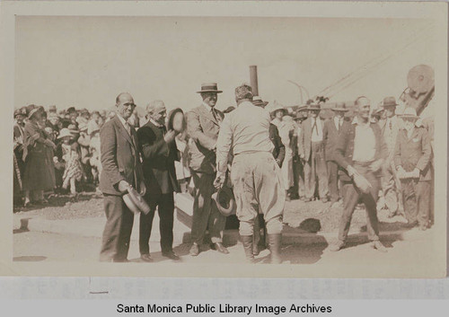 Men greeting one another at opening ceremony of Beverly (later Sunset) Blvd. including Dr. Charles Scott on the far left and Bishop Charles Burns next to him, August 18, 1925