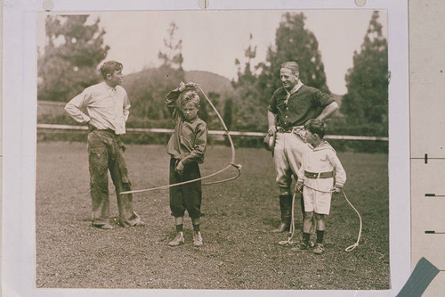 Will Rogers (left) roping with Snowy Baker and the Rogers children Will, Jr. (middle) and Jim (far right), Beverly Hills, Calif