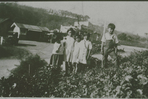 Children in front of the Marquez Family gas station in Santa Monica Canyon