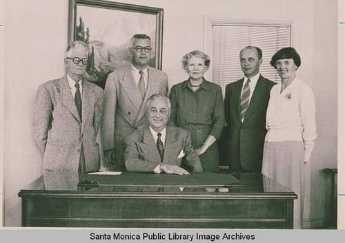 Santa Monica Land and Water Company Staff with Arthur Loomis (president) seated in the center and Lois Flagg (accountant) standing behind him