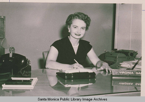 A woman sitting behind a desk in an office, Pacific Palisades, Calif