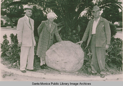 Setting the stone for the Ysidro Reyes Family landmark near the site of the old Reyes adobe, with Mrs. Kennedy representing the Landmark Society