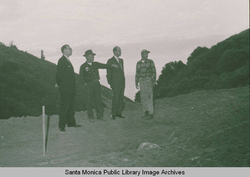 Public school officials looking over the site for the building of Palisades High School in Temescal Canyon